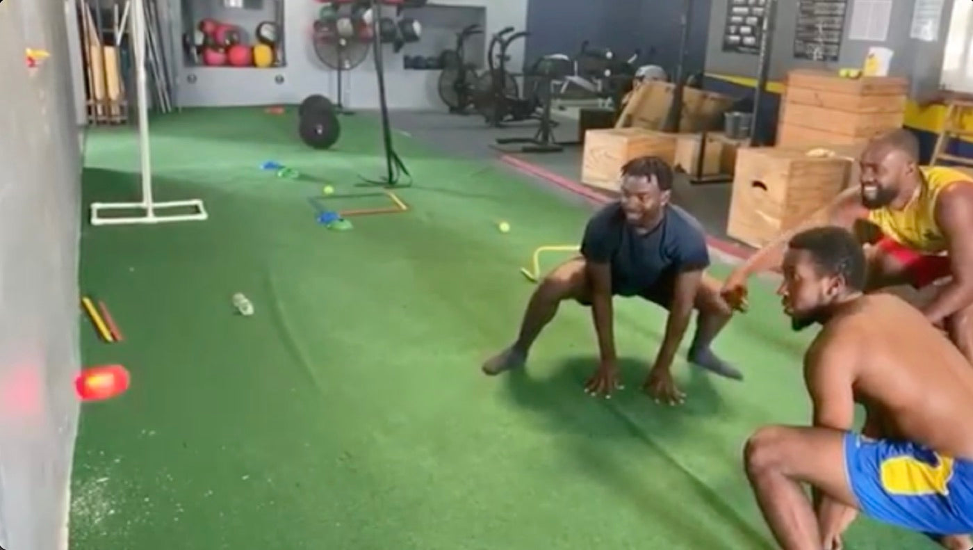 Group agility session on turf